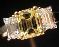 SOLD.....Three Stone Ring: Fancy Yellow Emerald Cut flanked by Coloress Emerald Cut Diamonds R1472
