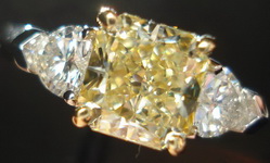 SOLD.....Three Stone Diamond Ring: GIA 1.30ct Radiant Fancy Light Yellow Diamond w/ heart side stone R1602
