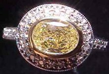 SOLD....Halo Diamond Ring- .69 Oval Set East West  Trade up special R2034